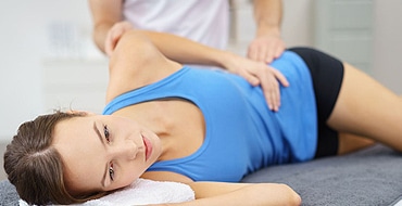 woman getting spine adjustment