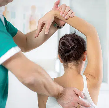 Chiropractor is doing the chiropractic treatment to the patient