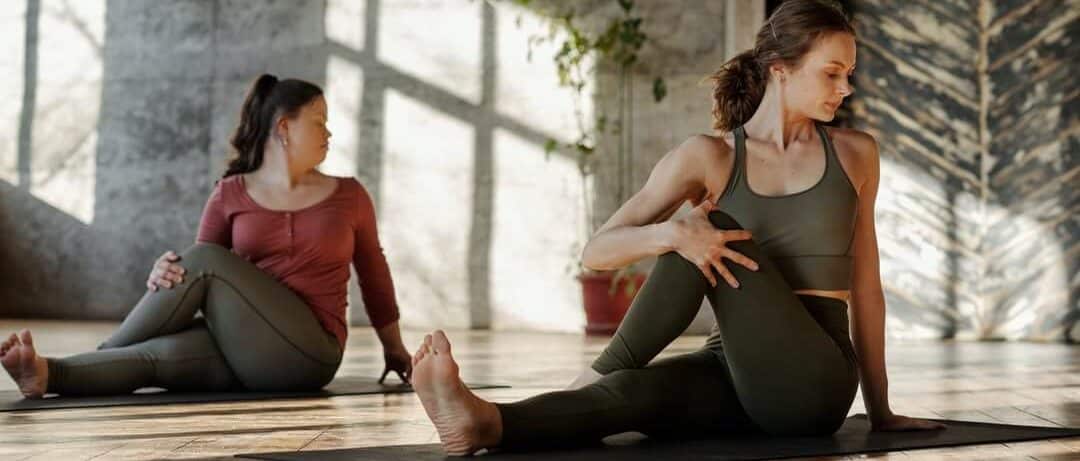 Two women doing corrective exercises