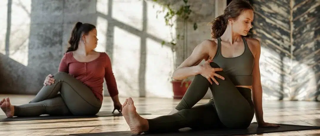 Two women doing corrective exercises