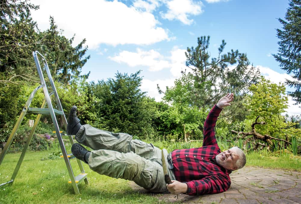Elderly man falling from the ladder