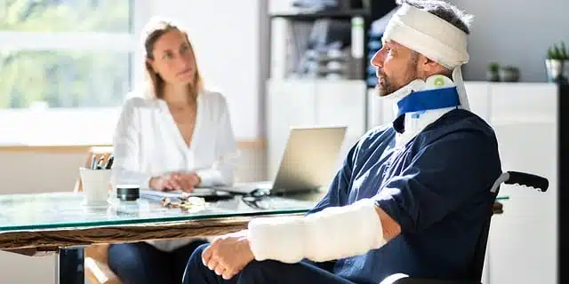 man with chiropractic care for head injuries at a clinic for a check up