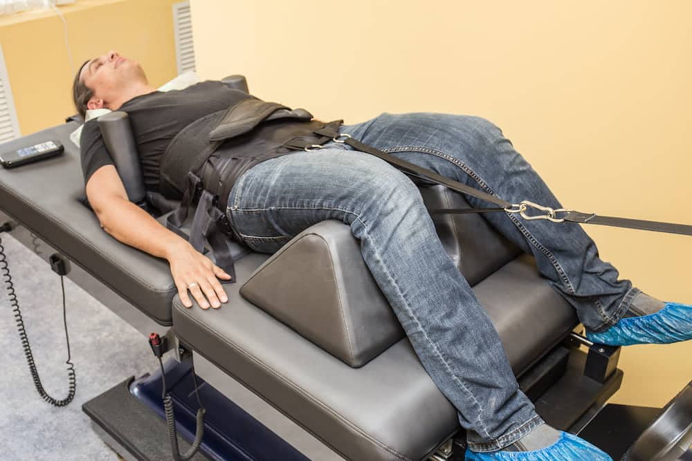 Flexion-Distraction Therapy on a middle-aged male patient